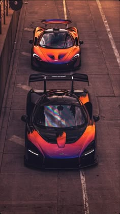 three colorful sports cars parked on the street