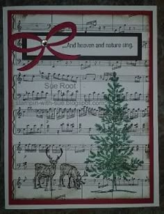 a card with sheet music and a christmas tree