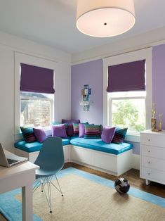 a living room with purple and blue decor