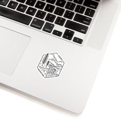 an open laptop computer sitting on top of a white desk