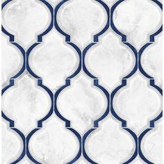 a white and blue tile wallpaper with an intricate design on the bottom half of it