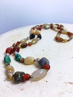 Luxury Brown Gemstone Beaded Necklace, Luxury Agate Jewelry With Gemstone Beads, Luxury Multicolor Agate Jewelry, Luxury Vintage Agate Beads, Cheap Vintage Beaded Necklaces With Polished Beads, Multicolor Agate Large Beaded Necklaces, Multicolor Large Beads Agate Necklace, Multicolor Agate Beaded Necklace With Large Beads, Multicolor Agate Gemstone Beads Necklace