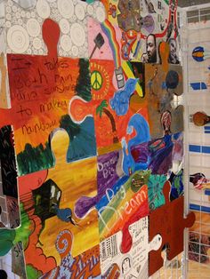 a wall covered in lots of different types of paper and magnets on top of it