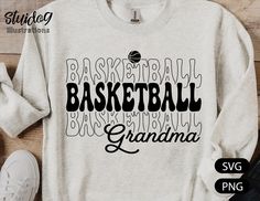 a sweatshirt with the words basketball and grandma on it, next to some sports equipment