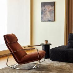 a chair and ottoman in a living room