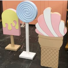 two ice cream cones with popsicles on them