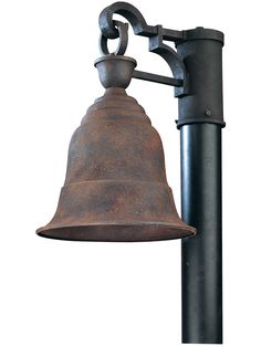 an old fashioned bell hanging from a pole