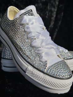 These beauties are great for weddings, birthdays, proms, sneaker balls, concert's, Quinceañera's, or any time you want to add a little Sparkle to your day! Purchasing this listing includes the LOW-TOP Converse All Star Platform shoes, original shoelaces and satin shoelaces. High Quality rhinestones will be used and you will need to notate the colors you are wanting. STYLE:*Bling Mix: This is a FULLY COVERED shoe, embellished with a mixture of different size Rhinestones covering all the canvas pa Elegant Low-top Bling Sneakers, Sporty Low-top Bling Sneakers, Silver Bling Low-top Sneakers, Low-top Synthetic Sneakers With Rhinestones, White Low-top Custom Sneakers With Bling, Converse Low, Low Top Converse, Converse Low Tops, Bling Converse