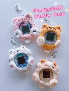 three small stuffed animals are hanging from key chains with the words tamagotchi fluffy case on them