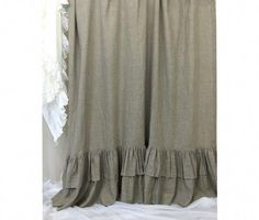 a curtain with ruffles hanging from it's side