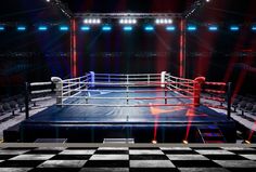 an empty boxing ring with red and blue lights in the middle is lit by spotlights