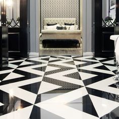 a black and white floor with a couch in it