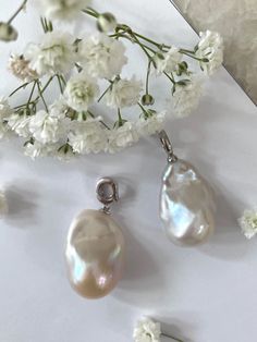 This beautiful, flawless baroque pearl, with its iridescent luster, shimmers like a treasure unearthed from the depths of an ancient ocean. Adorned with a shimmering s925 interchangeable bail peg, this pendant boasts the magical ability to adapt, allowing you to wear it with any chain of your choosing. Wear this enchanting jewel and carry a piece of the ethereal beauty of the sea, wherever your adventures may lead. Baroque Pearl Pendant, Wedding Bride Jewelry, Pearl Shop, Christmas Gift For Her, Ball Pendant, Pearl Pendant Necklace, Santa Clara, Ethereal Beauty, Pearl Size