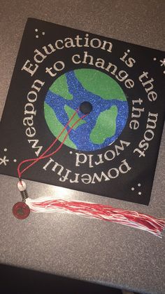 a graduation cap with the words education is change, and a tassel hanging from it