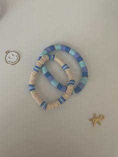 Blue Preppy Bracelets Fitting For any outfit! Stretchy elastic!! 2 Bracelets! 🌊 Aesthetic and preppy?? You got it! Right here!💗  Looking for handmade/homemade jewelry? Wel you came to the perfect place: Bracelet Bae Boutique! In my shop you will find beach, tropical, preppy, aesthetic, and more styled jewelry all for a good price! More details about my jewelry: Product information:  -Made by myself -clay beads -seed beads -faux pearls -golden beads -very stretchy elastic -golden chain ♡Shipped from PA in the USA♡ -Sizing on bracelets will be provided on the sizing option. If not please message or contact me. The owner or bracelet bae boutique. -Made in a clean area. -Made from all skin friendly materials If you have any questions or concerns on a product please message me! Main etsy page Bracelet Colors Clay Beads, Clay Bead Bracelet Ideas Minimalist, Clay Bead Bracelet Ideas With Gold Beads, Poly Clay Bead Bracelet, Cute Clay Bead Bracelet Ideas Green, Inspo For Clay Bead Bracelets, Clay Bead Necklace With Shell, Clay Bead Bracelet Ideas Tsitp, Beach Bracelets Aesthetic Clay Beads