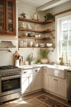 a kitchen filled with lots of open shelves next to a stove top oven and dishwasher