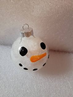 a snowman ornament hanging from the ceiling