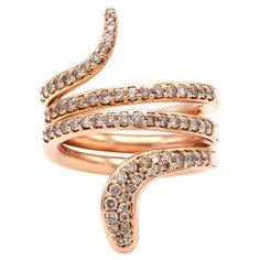 From Damiani's Eden Collection, the snake-shaped ring features 0.96 carat of diamonds in 18K rose gold.  Signed Damiani. Snake Ring, Gold Snake, 18k Rose Gold, Or Rose, Eden, Diamond Bracelet, 18k Gold, Jewelry Rings, Bangles