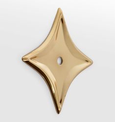 a gold star shaped object on a white background