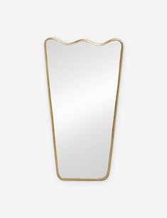 a mirror that is on the wall with gold trimmings and a white background