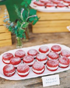 red velvet cupcakes are displayed on a plate