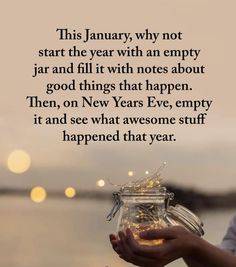 a person holding a jar filled with gold flakes in front of the ocean and saying,'this january, why not start the year with an empty jar and fill it with notes about good things