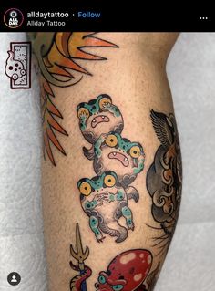 a tattoo on the leg of a person with an octopus and other animals around it