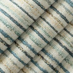 close up view of the fabric with blue and beige stripes