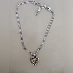 Vintage 925 Pandora Necklace With Triple Chain And Center Gold Plated Swinging Heart. Elegant Silver Heart Necklace In Sterling Silver, Elegant Silver Sterling Silver Heart Necklace, Elegant Silver Sterling Heart Necklace, Elegant Open Heart Jewelry With Sterling Silver Clasp, Elegant Silver Heart Necklace For Mother's Day, Elegant Sterling Silver Jewelry With Heart Beads, Elegant Silver Heart Necklace With Heart Beads, Elegant Heart Necklace With Silver Chain, Classic Silver Jewelry With Heart Charm