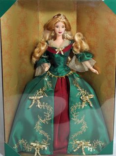 a barbie doll in a green and red dress with gold trimmings on it