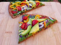 two slices of vegetable pizza on a cutting board