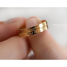 "Personalized and meaningful gift for you and your loved one. Please, read our descriptions before placing your order. SOLD SEPARATELY. PS: Due to the small size of the band ( 2mm ), we can only engrave so big. No color is used to fill in the letters to give contrast. Please, dont expect engraving to be like printing - very visible. Engraving is more subtle in appearance as light reflects differently off of the engraving as compared to the metal surface. Sizing Standard US sizing. Our ring is tr Personalized Dainty Gold Engraved Ring, Meaningful Promise Ring With Engraving Option, Meaningful Engraved Promise Ring With Engraving Option, Personalized Yellow Gold Stackable Round Rings, Meaningful Engraved Ring For Promise, Classic Engraved Promise Jewelry, Meaningful Stamped Jewelry For Promise, Heirloom Adjustable Engraved Ring For Promise, Adjustable Heirloom Engraved Ring For Promise