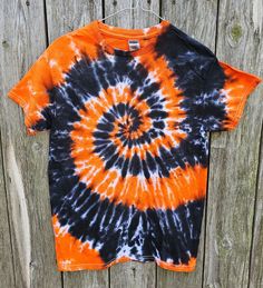 Spooky season is right around the corner! Be ready for the fall with this cyclone tee. Each shirt is unique in its own design since each shirt is hand dyed. The shirt above is similar to the shirt you will receive, but each shirt will have its own vibe of character. Handmade tie dye shirt made with permanent Procion fiber reactive dyes. Dyed on a 100% cotton Gildan T-shirt. The shirt has been pre-washed and rinsed several times to ensure the color will stay. Recommended to wash with dark or like colors in cold water, although washed several times already. Tumble dry low or air dry. Please contact me directly if any questions or if interested in a large quantity order. Casual Tie-dye Halloween Top, Casual Tie Dye Halloween Tops, Casual Tie Dye Tops For Halloween, Halloween Tie-dye Casual T-shirt, Halloween Casual Tie Dye T-shirt, Casual Halloween Tie-dye T-shirt, Casual Halloween Tie Dye T-shirt, Clothes For Teens