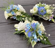 three bridal bouquets with blue and white flowers