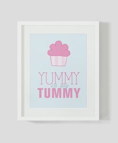 a pink cupcake with the words yummy is my tummy in pink on a blue background