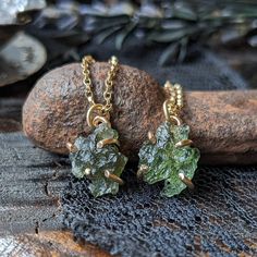 "AAA Grade .5 gram genuine moldavite is set in a handcrafted 14k gold prong setting and suspends from a 14k gold lightweight & sturdy 1.1mm cable chain. Moldavite was formed long ago along from a meteor impact in Germany, the Reisky crater. They are referred to as \"the mysterious tears from heaven\" and are actually a glass versus a stone, classified as tektites. They are unique as they are the only tektites that are green in color making them rare and the most desirable for adornment. 99% of a Untreated Recycled Gold Jewelry As A Gift, Untreated Recycled Gold Jewelry Gift, Recycled Gold Untreated Jewelry As A Gift, Handmade 14k Gold Green Jewelry, Handmade Green 14k Gold Jewelry, Gold Untreated Jewelry As A Gift, Hand Forged Nugget Jewelry As Gift, Green Recycled Gold Jewelry For Gift, Meteor Impact