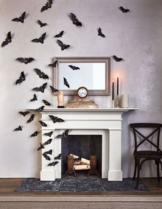 a fireplace with bats flying around it