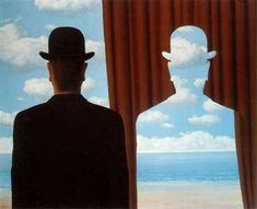 a man standing in front of a window looking out at the ocean with two silhouettes behind him