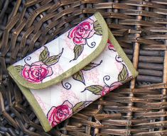 a purse sitting on top of a wicker basket