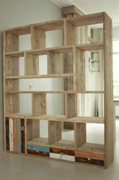 a wooden shelf with several shelves in it