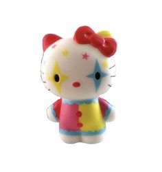 a hello kitty figurine sitting on top of a white surface