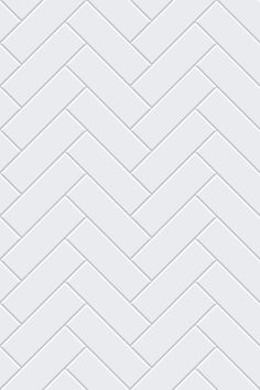 a white brick wall that has been made into a chevron pattern in the middle