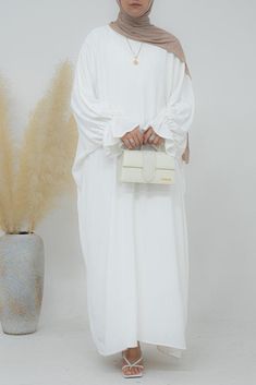 Radwa batwing abaya with ruched sleeve and loose cut in white - ANNAH HARIRI Batwing Abaya, Modest Activewear, Full Coverage Swimsuit, Ruched Sleeve, Abaya Dress, Trendy Colors, Modest Dresses, Color Style, Active Wear Tops