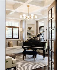 a living room with a piano in it