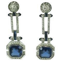 Fine Art Deco earrings from the 1930's. Wonderful articulated design with large square cut faux sapphires falling from pave links with sapphire accents. Beautifully detailed connectors with calibre set faux sapphires and bullet cab terminals. Original screw back fittings. Set in rhodiumed metal. Amazing quality. Original Saks Fifth Ave. box. 1930's USA. 2.25" x .75". Art Deco Drop Earrings, Blue Art Deco, Platinum Earrings, Jewellery Indian, Ring Styles, Deco Earrings, Earrings Antique, Bridal Jewellery Indian, Onyx Earrings