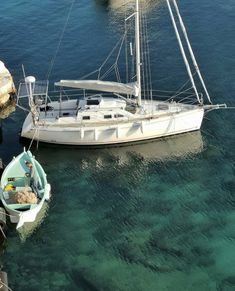 two boats in the water next to each other