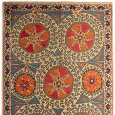 an orange and blue rug with circular designs