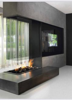 a modern fireplace in the middle of a room