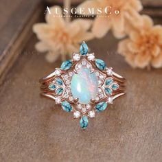 an opal and diamond ring with blue stones