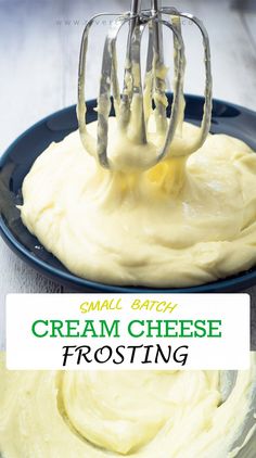 cream cheese frosting being whisked into a blue bowl with a metal mixer